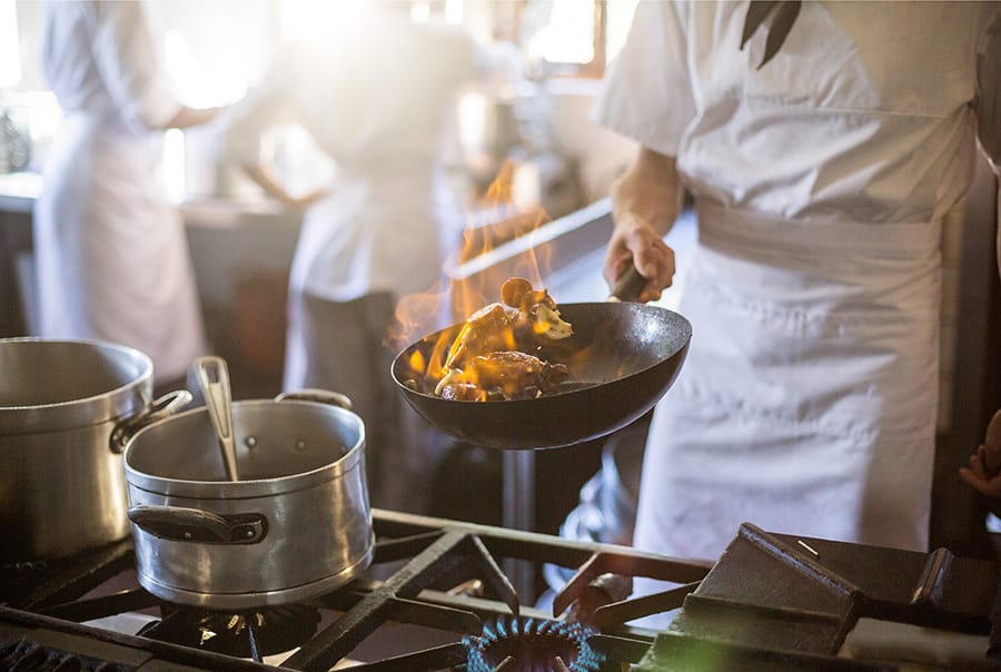 Meals being prepared in restaurant kitchen